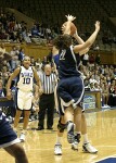 Linsdey Harding looks on as Penn State's Courtney Molinaro attempts to block an Alison Bales shot...