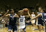 Linsdey Harding guarded by Kamela Gissendanner (left)