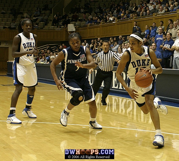 Lindsey Harding drives as Brianne O'Rourke attempts to recover on defense