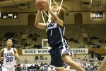 Carrem Gay trails the break as Tyra Grant goes for the layup.