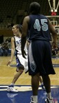 Abby Waner looks to the wing as Old Dominion's Tiffany Green protects the lane