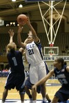 Joy Cheek twists around ODU's Tamara Ransburg on her way to the basket...