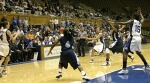 Wanisha Smith passes to Abby Waner, as Bridgette Mitchell establishes in the lane