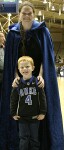 "Crazy Cape Girl" Sarah Bales (younger sister of Alison) poses with a young fan