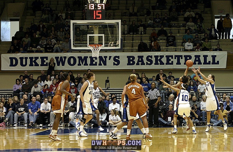 Abby Waner (right) attempts to recover on defense as Carla Cortijo shoots