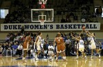 Abby Waner (right) attempts to recover on defense as Carla Cortijo shoots