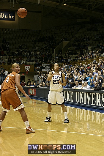 Wanisha Smith makes the entry pass past Texas' Erika Arrarian