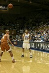 Wanisha Smith makes the entry pass past Texas' Erika Arrarian