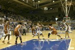 Carla Cortijo is called for the block as Wanisha Smith drives into the lane (1 of 2)