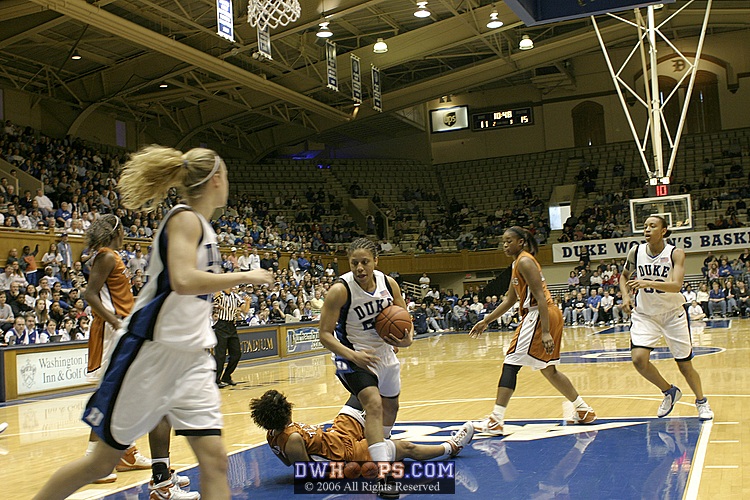 Carla Cortijo is called for the block as Wanisha Smith drives into the lane (2 of 2)