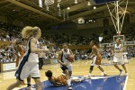 Carla Cortijo is called for the block as Wanisha Smith drives into the lane (2 of 2)