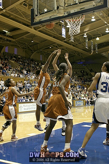 Earnesia Bailey goes over the back of Wanisha Smith