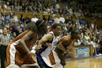 Tiffany Jackson (left), Joy Cheek, and Earnesia Williams fight for position on a Duke free throw attempt (1 of 2)