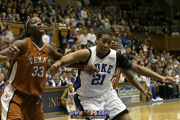 Tiffany Jackson (left), Joy Cheek, and Earnesia Williams fight for position on a Duke free throw attempt (2 of 2)