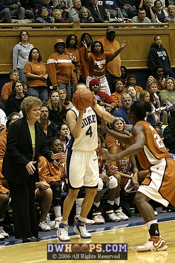 Texas Head Coach Jody Conradt and a Texas supporter express their displeasure with Abby Waner's 3 point attempt