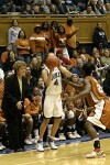 Texas Head Coach Jody Conradt and a Texas supporter express their displeasure with Abby Waner's 3 point attempt