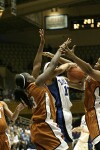 Houston Cy-Fair Alumnae Aubry Cook (left) and Lindsey Harding join fellow Texan Katrina Robinson in a battle for the ball.  Cook was called for the foul.