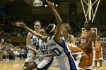 Lindsey Harding and Abby Waner try to get the ball from Niqky Hughes