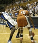 Texas guard Brittainey Raven clears out Bridgette Mitchell